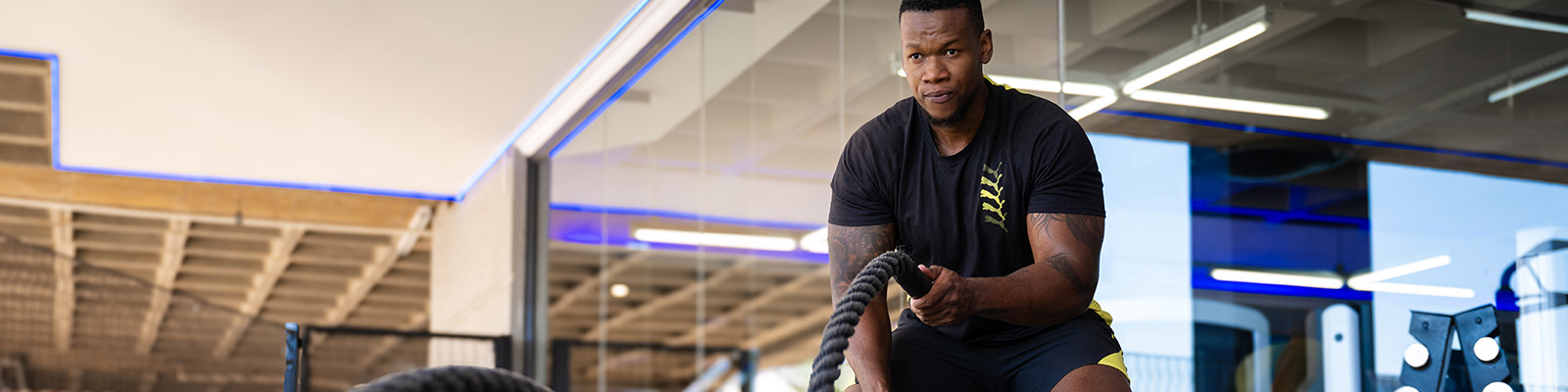 Man doing rope training at Planet Fitness